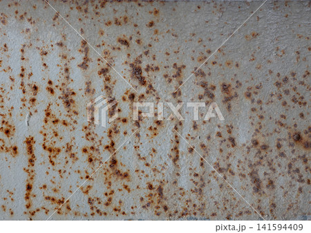 Rusty metal surface with peeling paint grunge industrial background textured metal wall for design use. Rusty metal surface with peeling paint grunge industrial background textured metal wall for design use. 141594409