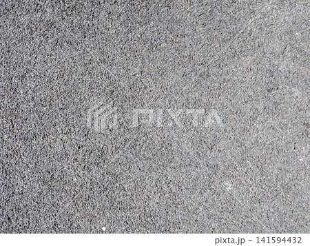 Rubber sports surface background outdoor playground flooring texture under asphalt shock absorbing material. 141594432