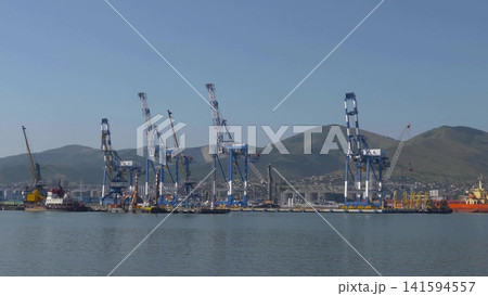 August 22 2025 View of Novorossiysk port Russia with cargo ships and cranes on the coastline. Industrial maritime scene on the Black Sea August 22 2025 View of Novorossiysk port Russia with cargo ships and cranes on the coastline. Industrial maritime scene on the Black Sea 141594557