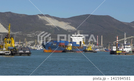 August 24, 2025: Large cargo ship entering the port of Novorossiysk, Russia, on the Black Sea, illustrating maritime transport, industrial shipping and coastal infrastructure August 24, 2025: Large cargo ship entering the port of Novorossiysk, Russia, on the Black Sea, illustrating maritime transport, industrial shipping and coastal infrastructure 141594581