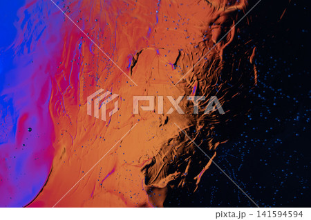 Abstract colorful liquid texture with orange, blue, and black areas and tiny spreading droplets Abstract colorful liquid texture with orange, blue, and black areas and tiny spreading droplets 141594594