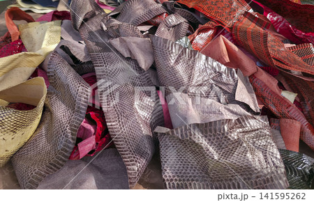 Bright assortment of exotic snake and reptile leather skin craft materials on display Bright assortment of exotic snake and reptile leather skin craft materials on display 141595262