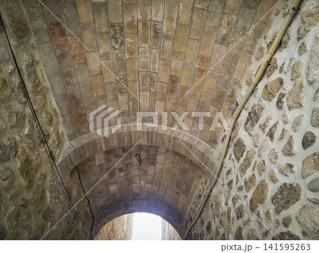 Ancient brick vaulted archway viewed from below in a stone tunnel setting Ancient brick vaulted archway viewed from below in a stone tunnel setting 141595263
