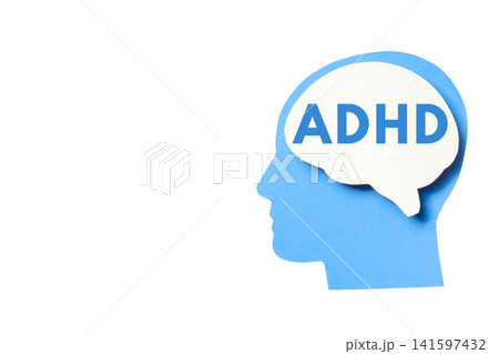 A blue head silhouette shows the ADHD label inside a brain 141597432