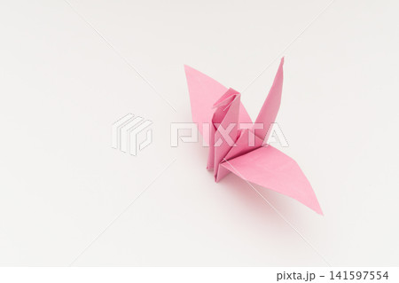 Pink Origami Paper Crane Isolated on White Background Pink Origami Paper Crane Isolated on White Background 141597554