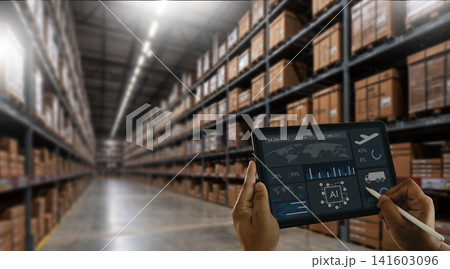 Hands monitor a tablet dashboard in a warehouse, using AI data, inventory tracking, logistics analytics, export planning, shipment report, and supply management for storage operations. 141603096