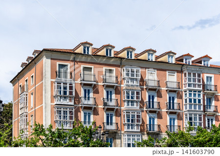Old residential building facade in Santander, Spain, featuring balconies and dormer windows. Old residential building facade in Santander, Spain, featuring balconies and dormer windows. 141603790