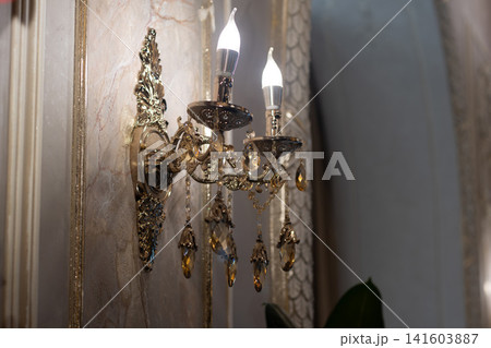 Vintage Crystal Wall Sconce in Elegant Luxury Interior Vintage Crystal Wall Sconce in Elegant Luxury Interior 141603887