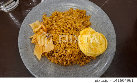 Mie Goreng Indonesian Fried Noodles with Omelet and Dumpling Chips 141604961