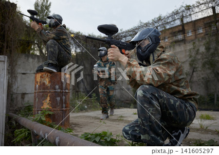 Group of soldiers take defensive positions and preparing for the attack during tactical training Group of soldiers take defensive positions and preparing for the attack during tactical training 141605297