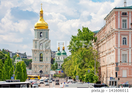 Golden domes Sophia of Kyiv is a cathedral of the 11th century and tall towers stand in city on sunny day. 05.12.2019. Kyiv. Ukraine Golden domes Sophia of Kyiv is a cathedral of the 11th century and tall towers stand in city on sunny day. 05.12.2019. Kyiv. Ukraine 141606011