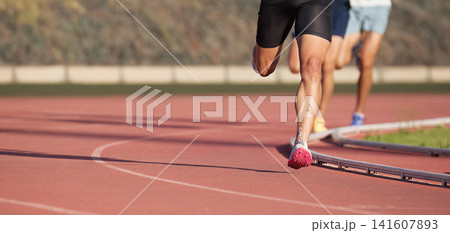 Athletics people running on the track field.Running a race on a track for sports competition and winning Athletics people running on the track field.Running a race on a track for sports competition and winning 141607893