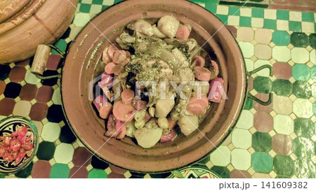 Freshly Served Traditional Moroccan Chicken Tagine with Root Vegetables Freshly Served Traditional Moroccan Chicken Tagine with Root Vegetables 141609382