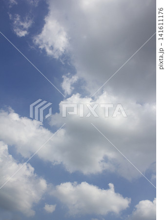 It is a blue sky with fluffy clouds. It is a blue sky with fluffy clouds. 141611176