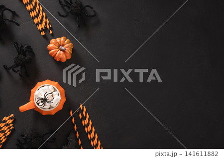 Halloween pumpkin mug with marshmallows and copy space 141611882