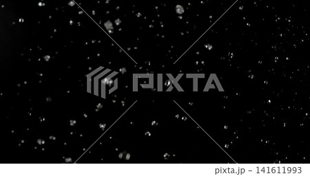 High speed close up of falling rain droplets isolated on a black background creating a realistic weather VFX overlay perfect for cinematic compositing visual effects motion graphics and atmospheric 141611993