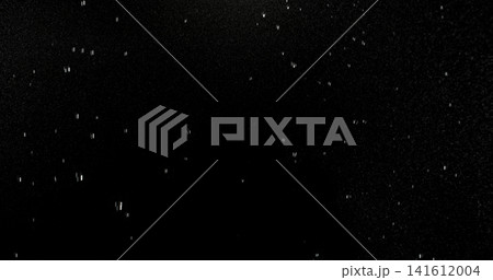 High speed close up of falling rain droplets isolated on a black background creating a realistic weather VFX overlay perfect for cinematic compositing visual effects motion graphics and atmospheric 141612004