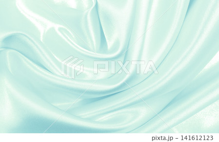 Smooth elegant blue silk or satin luxury cloth texture as abstract background. Luxurious background design Smooth elegant blue silk or satin luxury cloth texture as abstract background. Luxurious background design 141612123
