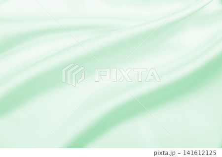 Smooth elegant green silk or satin luxury cloth texture as abstract background. Luxurious background design Smooth elegant green silk or satin luxury cloth texture as abstract background. Luxurious background design 141612125