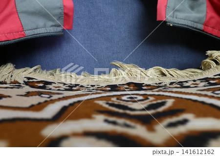 A collage of denim and carpet. A collage of denim and carpet. 141612162