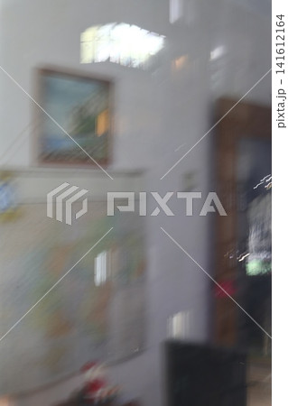 The reflection of the room in the window. 141612164