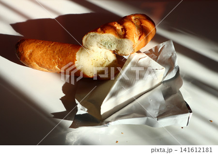 Baguette with garlic and cheese brie. Baguette with garlic and cheese brie. 141612181