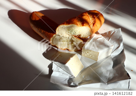 Baguette with garlic and cheese brie. Baguette with garlic and cheese brie. 141612182