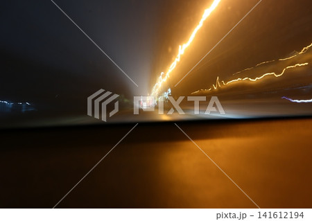 Abstract image of multicolored lights in the city. Abstract image of multicolored lights in the city. 141612194