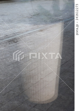 The reflection of the interior on the paving slabs. The reflection of the interior on the paving slabs. 141612273