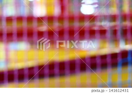 A blurred image of an entertainment center. A blurred image of an entertainment center. 141612431