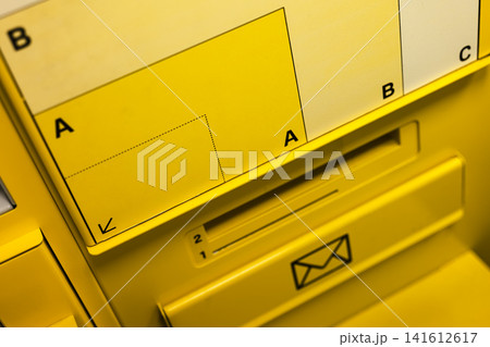 Yellow parcel locker kiosk for self service shipping, illustrating contactless and convenient modern postal solutions. Yellow parcel locker kiosk for self service shipping, illustrating contactless and convenient modern postal solutions. 141612617