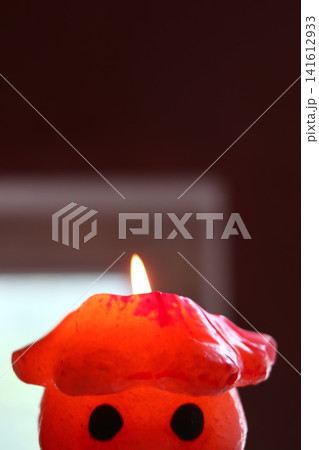 A burning candle in the form of a figurine. A burning candle in the form of a figurine. 141612933