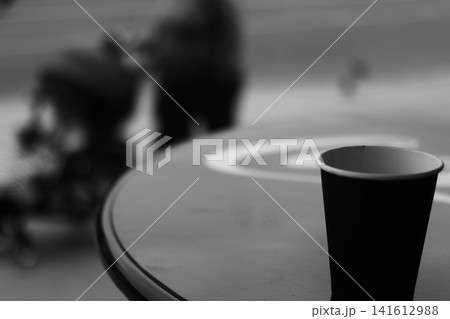 A coffee cup made of kraft paper on the table. 141612988