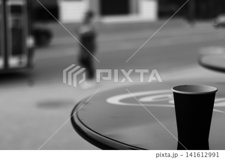 A coffee cup made of kraft paper on the table. A coffee cup made of kraft paper on the table. 141612991