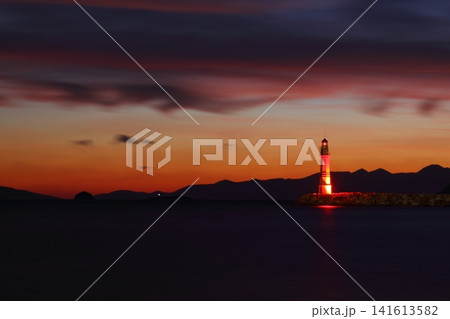 Seascape at sunshine. Lighthouse and sailings on the coast. Seaside town of Turgutreis and spectacular sunshine. Long Exposure shoot. tranquility scene. Seascape at sunshine. Lighthouse and sailings on the coast. Seaside town of Turgutreis and spectacular sunshine. Long Exposure shoot. tranquility scene. 141613582