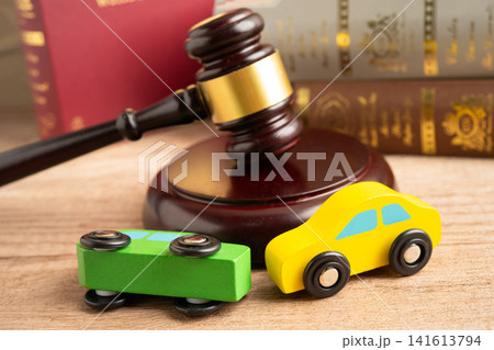 Car accident lawsuit and insurance, Judge hammer with car model. Car accident lawsuit and insurance, Judge hammer with car model. 141613794