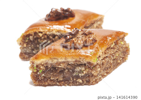Walnut baklava isolated on white. Turkish traditional dessert Walnut baklava isolated on white. Turkish traditional dessert 141614390