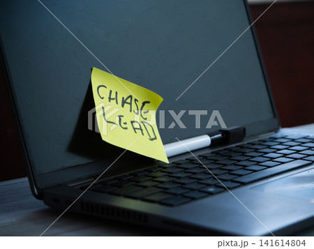 Silver grey laptop with reminder not on white desk in office Silver grey laptop with reminder not on white desk in office 141614804