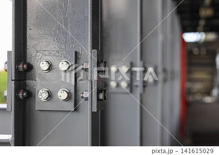 Metal supports Bolts, nuts, threaded on beams of the Steel Construction. Metal supports Bolts, nuts, threaded on beams of the Steel Construction. 141615029
