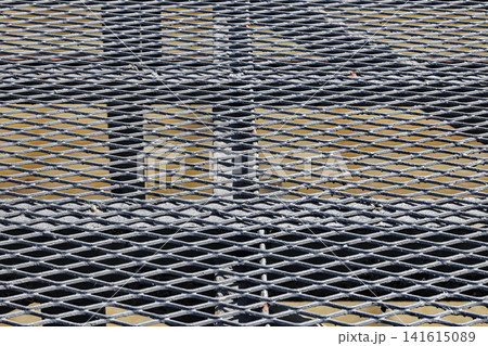 Detail of grate steel floor, floor grating, industrial grates profiled drainage latticed flooring. Detail of grate steel floor, floor grating, industrial grates profiled drainage latticed flooring. 141615089