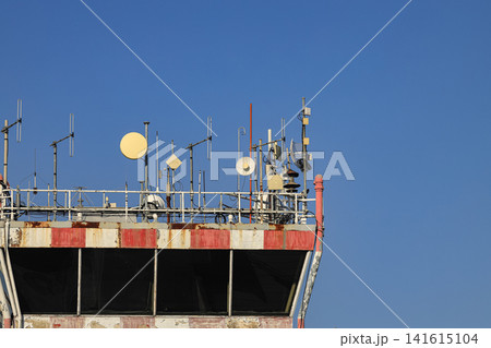 Many of transmitting and radio antenna over Air traffic control tower at international airport. Many of transmitting and radio antenna over Air traffic control tower at international airport. 141615104