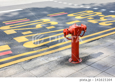 Old red fire hydrant vintage style in the city center street. Old red fire hydrant vintage style in the city center street. 141615164