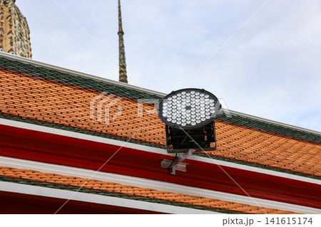 Modern LED spotlights installed on The edge of the roof of the place to illuminate outdoor area. 141615174