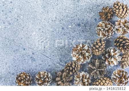 Christmas or New Year background with pine cones on gray background. Winter concept, top view 141615812