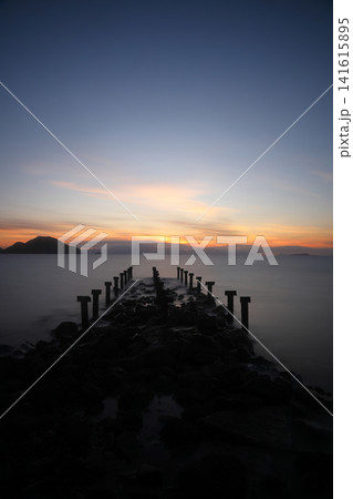 old, rusty abandoned and dismantled pier. sky space is empty. suitable for writing. Seaside town of Turgutreis and spectacular sunshine. Long Exposure shoot. tranquility scene. old, rusty abandoned and dismantled pier. sky space is empty. suitable for writing. Seaside town of Turgutreis and spectacular sunshine. Long Exposure shoot. tranquility scene. 141615895