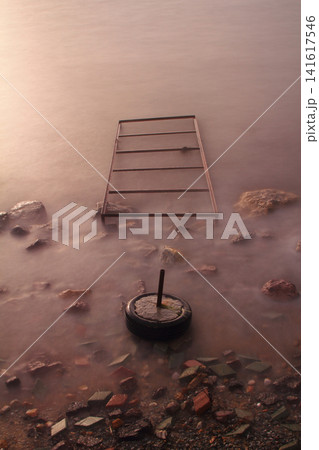 old, rusty abandoned and dismantled pier. sky space is empty. suitable for writing. old, rusty abandoned and dismantled pier. sky space is empty. suitable for writing. 141617546