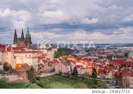 View of Prague captured from Strahov Hill with dramatic clouds move across the sky and changing View of Prague captured from Strahov Hill with dramatic clouds move across the sky and changing 141617713