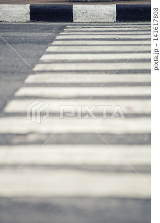 Abstract view of a pedestrian crossing with black and white stripes on asphalt Abstract view of a pedestrian crossing with black and white stripes on asphalt 141617808