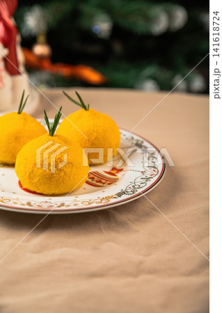 Healthy New Year mochi desserts in mandarin shape on festive plate with copy space for text dairy free lactose low calorie natural ingredients holiday Healthy New Year mochi desserts in mandarin shape on festive plate with copy space for text dairy free lactose low calorie natural ingredients holiday 141618724