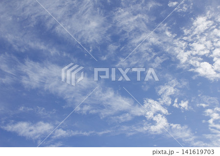 It is a blue sky with cirrocumulus clouds. It is a blue sky with cirrocumulus clouds. 141619703